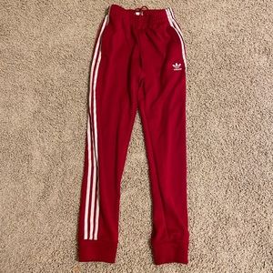 Red track adidas pants
